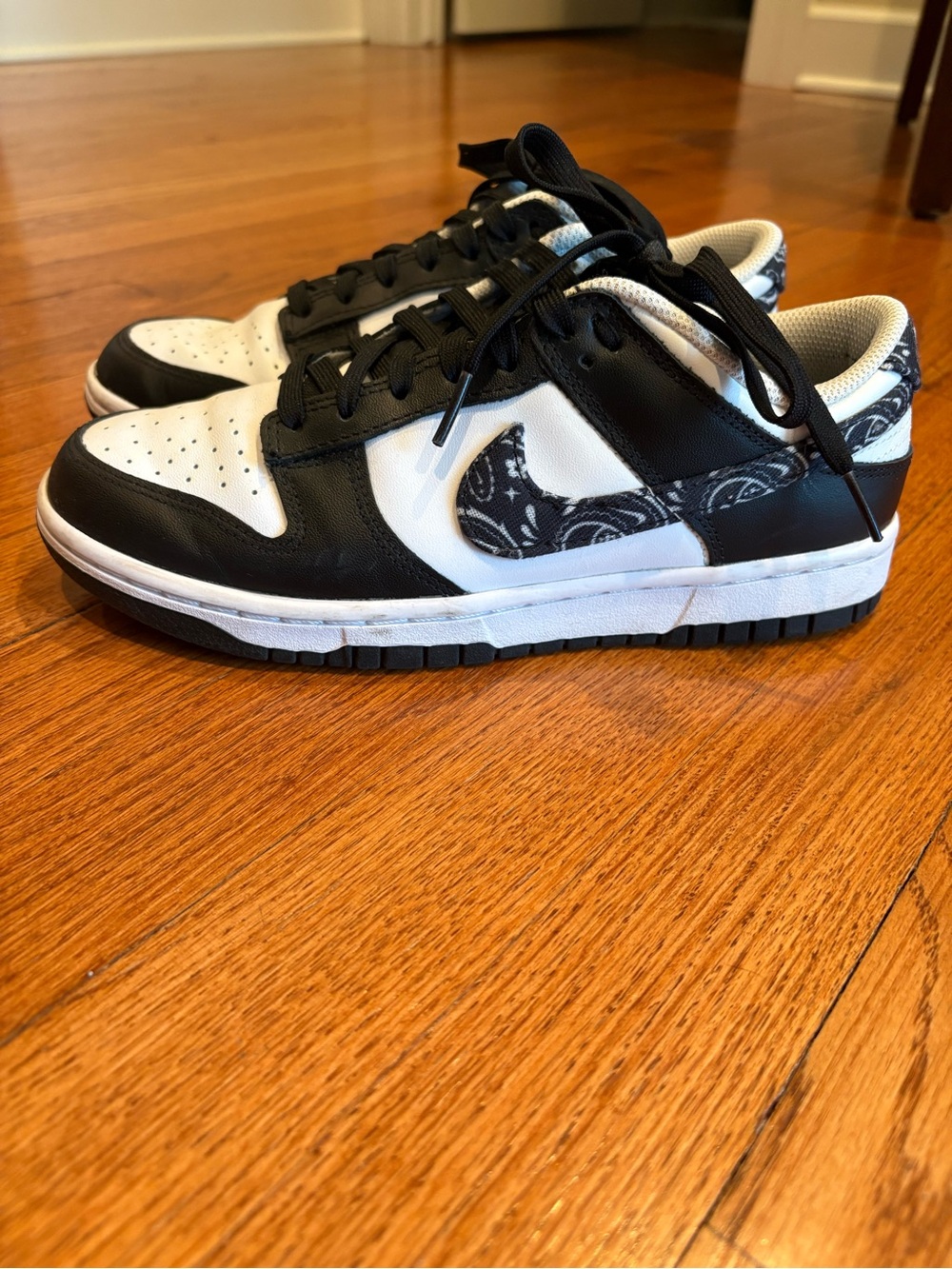 Nike Black and White Low-Top Sneakers with Paisley Swoosh